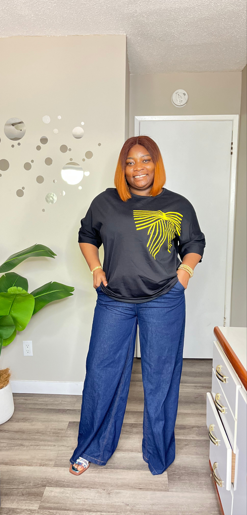 Black top with yellow bow